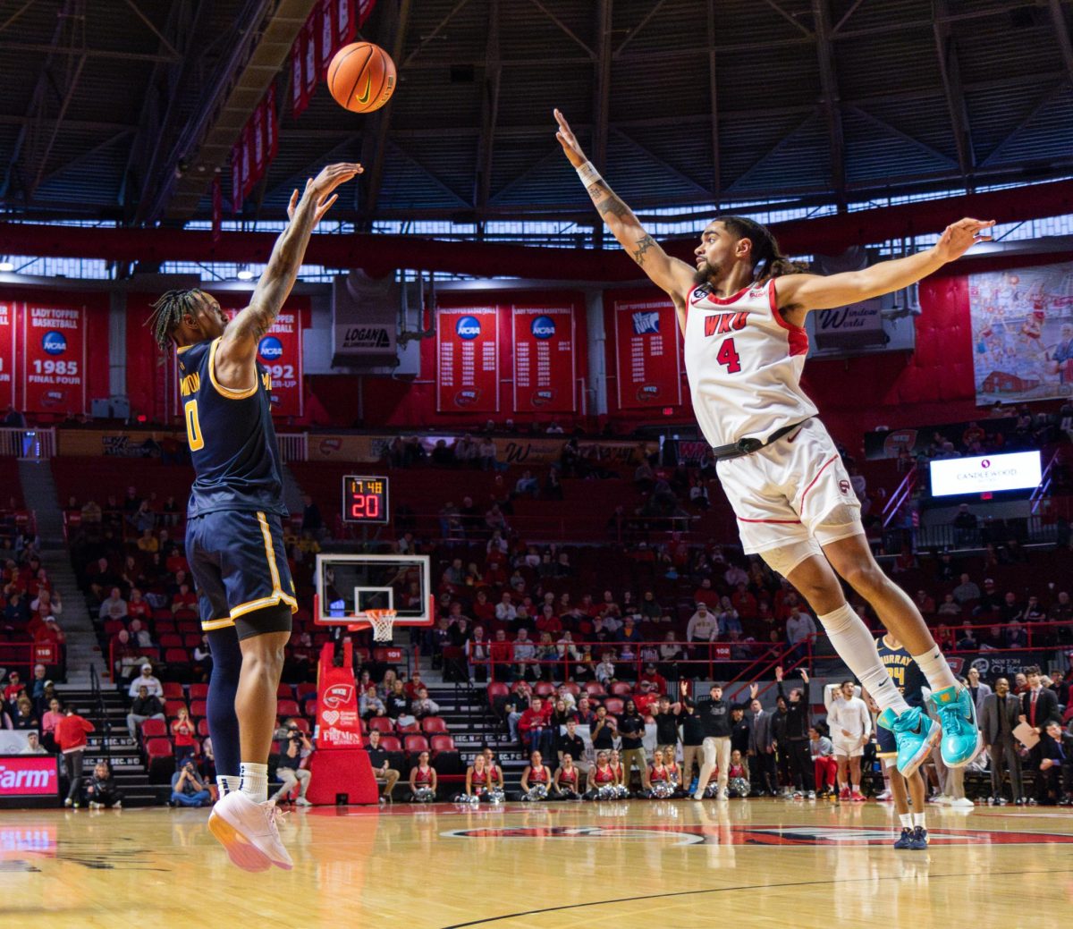 Senior guard Kylen Milton shoots a three over a WKU defender.