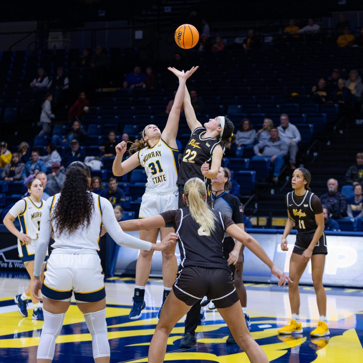 Graduate student forward Katelyn Young tips off against Valparaiso. 