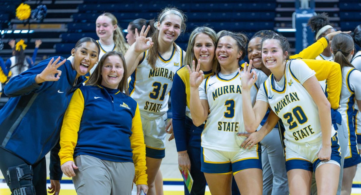 Members of the team pose for a picture after winning the game. 