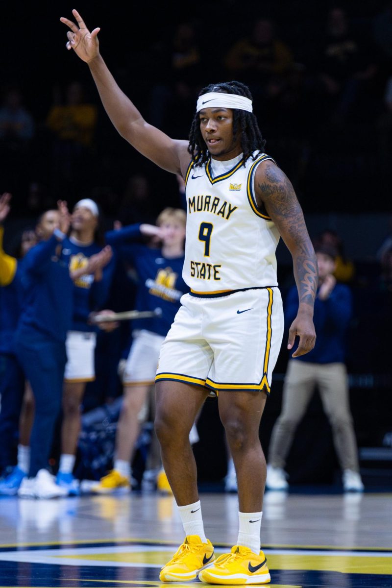 Senior guard Terence Harcum celebrates after making a three pointer. 