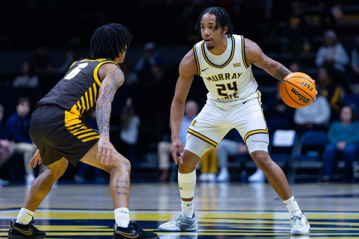 Senior guard JaCobi Wood sizes up a Valpo defender at the top of the key. 