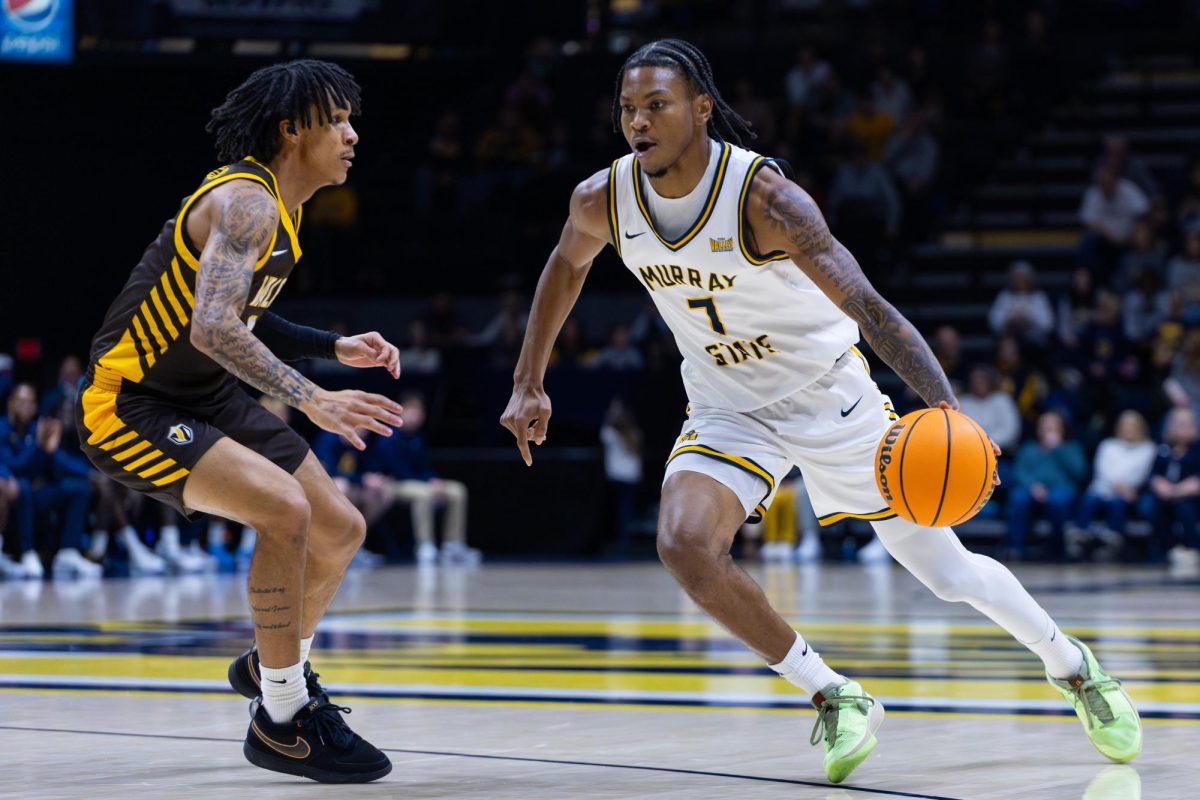 Senior guard AJ Ferguson drives past a Valpo defender. 