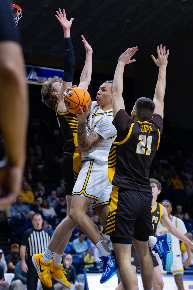 Junior forward KyeRon Lindsay fights through contact to the basket. 