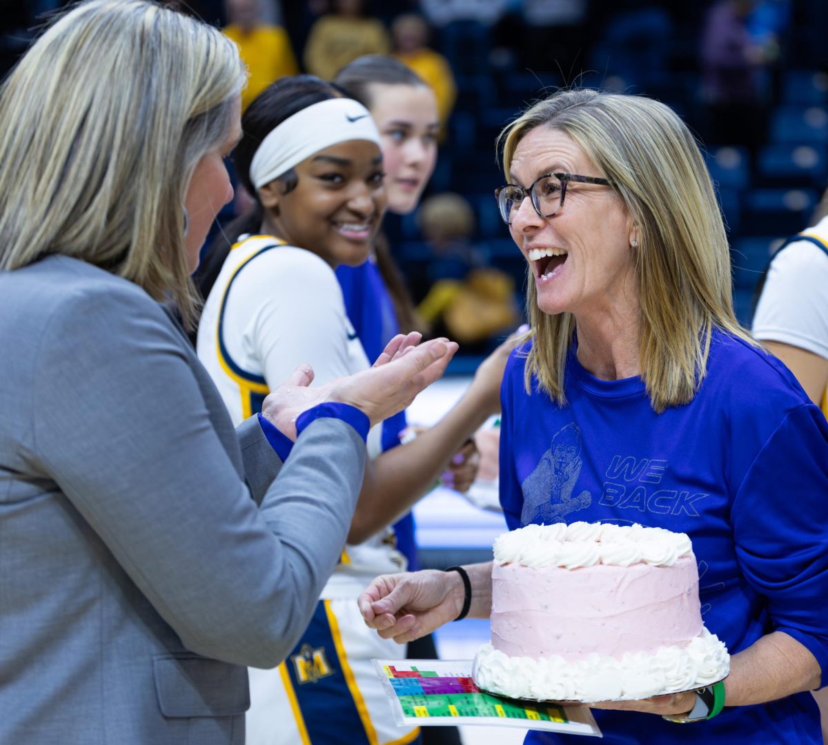 Head Coach Rechelle Turner celebrates with assistant coach Monica Evans after becoming the all-time wins leader. 