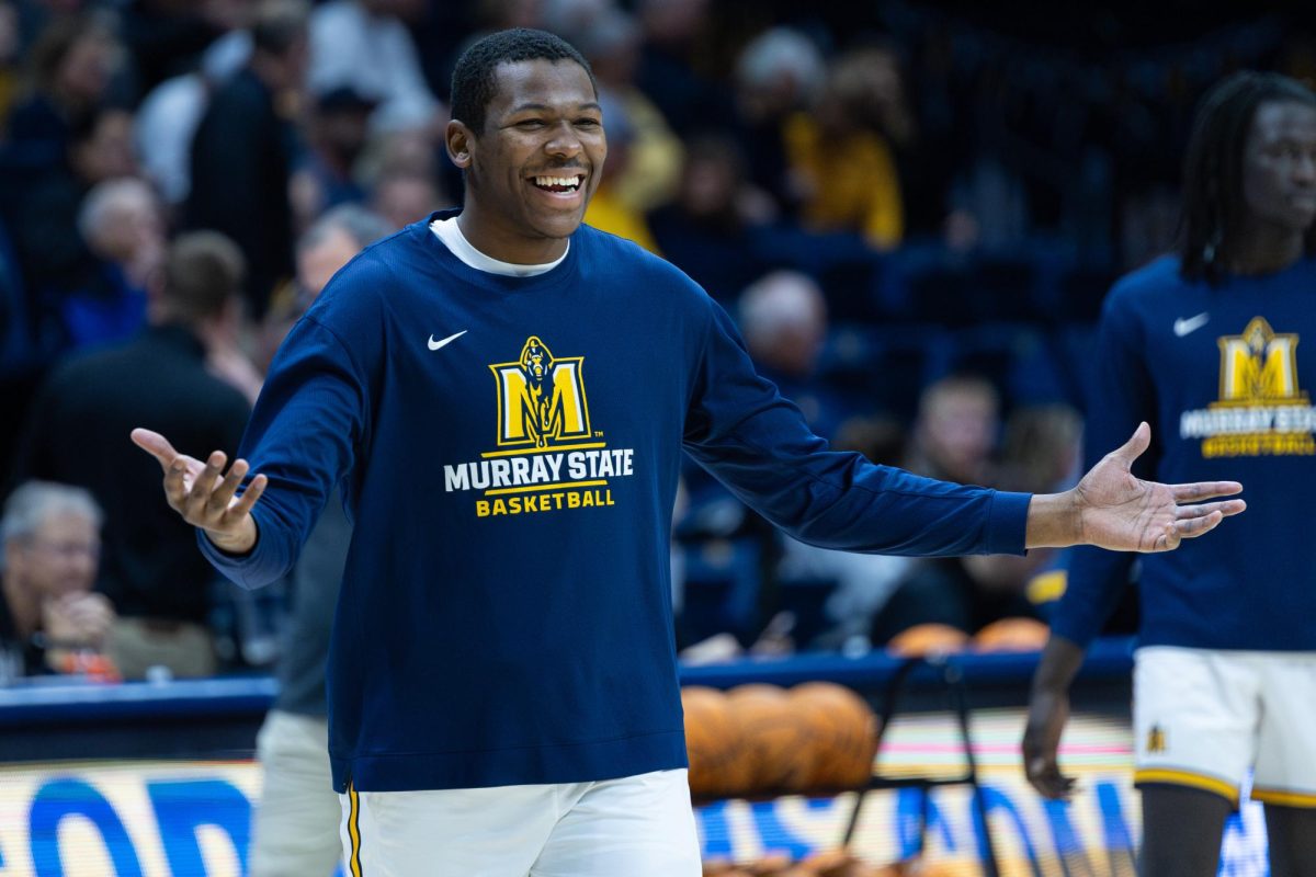 Senior forward Nick Ellington smiles during warmups. 