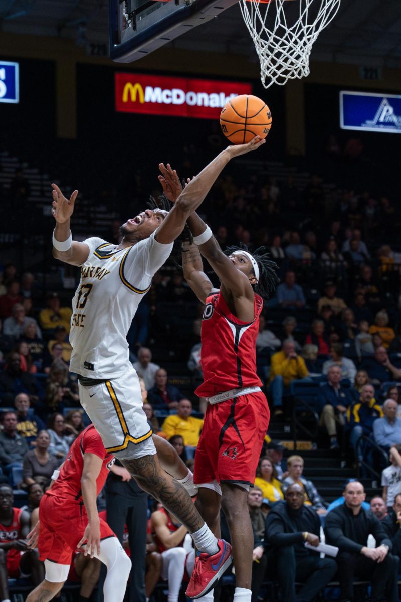 Junior forward Alden Applewhite finishes a tough basket at the rim.