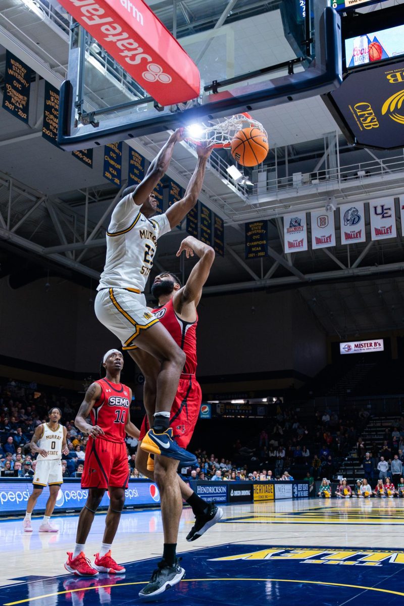 Senior forward Nick Ellington slams down a two-handed dunk.