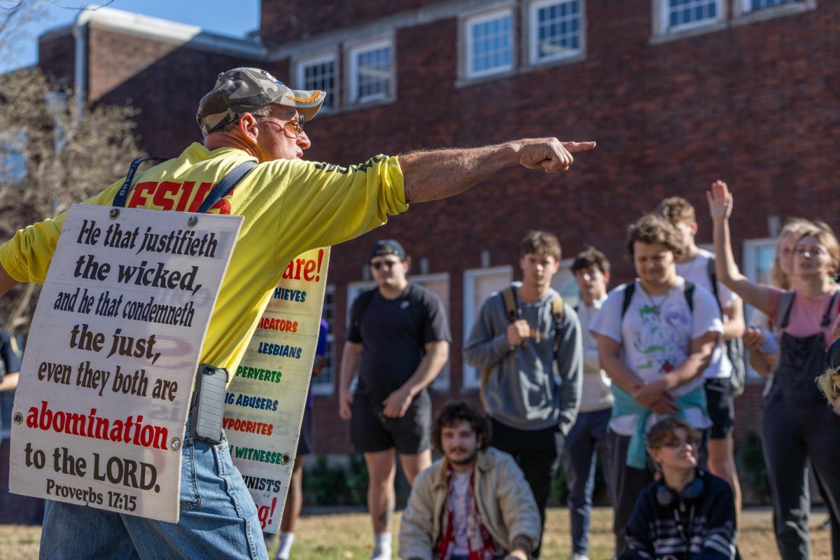 Religious demonstrator Matt Bourgault points and yells at students. 