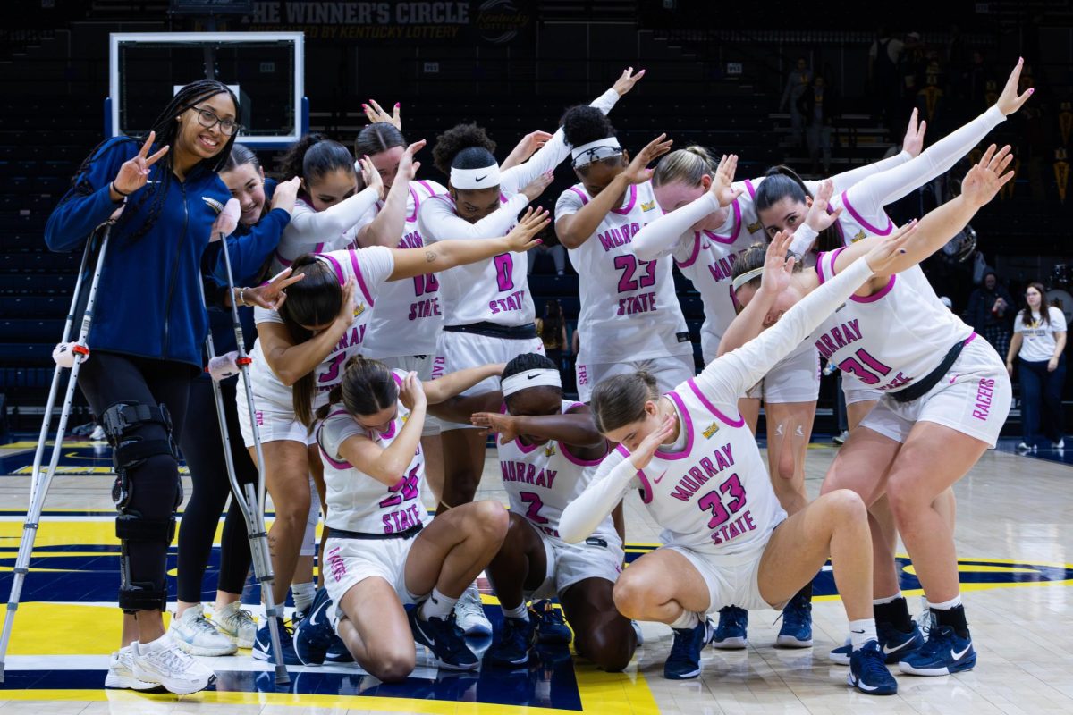 The team poses for a picture after the win. 