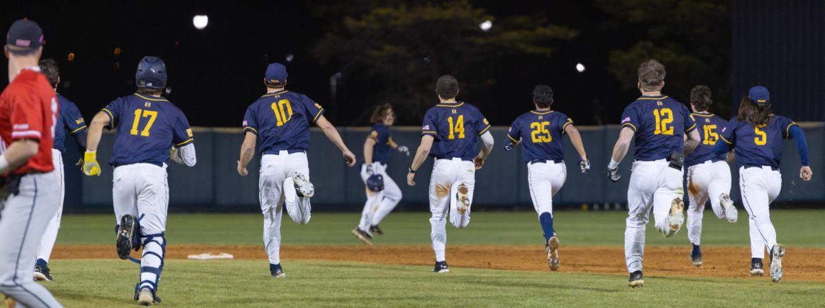 The team chases down R-Sr. outfielder Dan Tauken after driving in the winning run. 