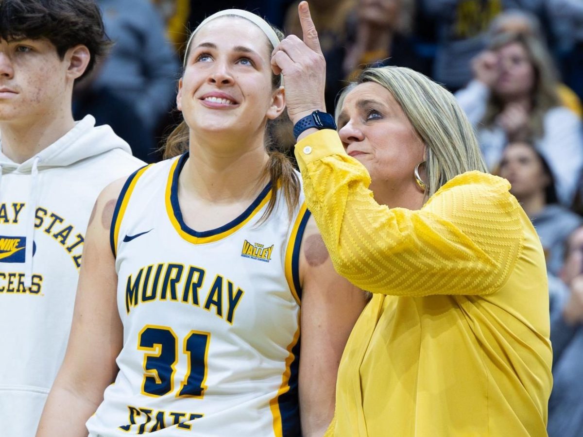 Rechelle Turner pointing at Katelyn Young's Jersey.