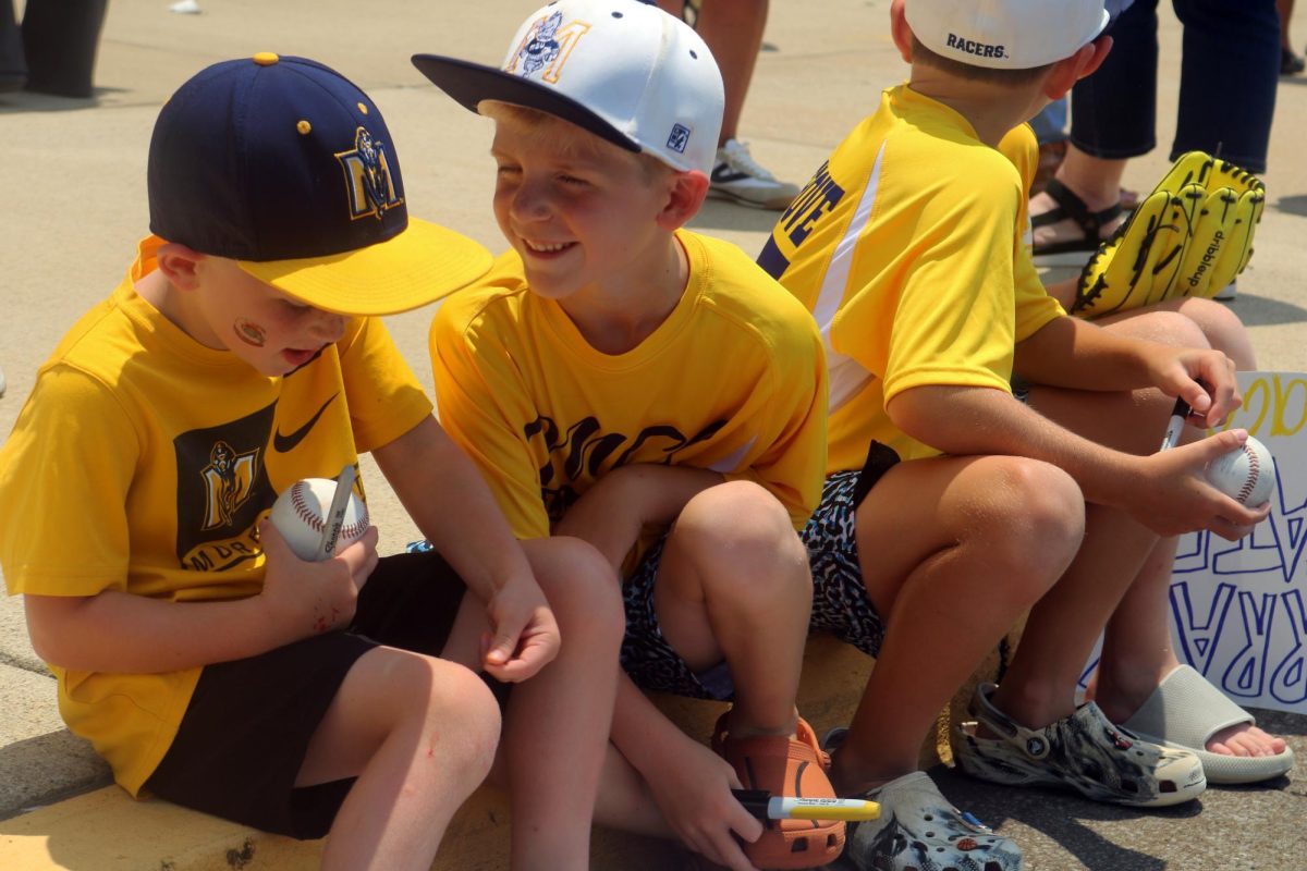 Nox Collins, left, and Jack Hargrove, right, talk as they waited for the Racers to return from the Super Regionals. The Racers defeated Duke 5-4 in the elimination game to advance to the College World Series. Nox, Jack and their friends Grayson Hargrove and Cole Collins are friends with coach Dan Skirka's son.