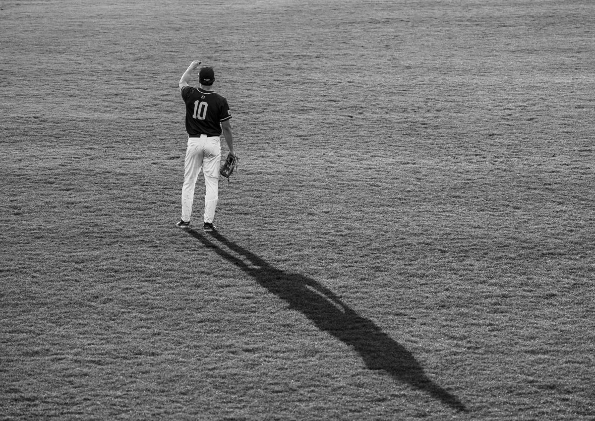 Dustin Mercer in the outfield at Johnny Reagan Field.
