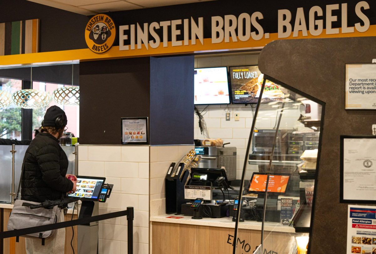 A student ordering with the newly installed GrubHub tablets.