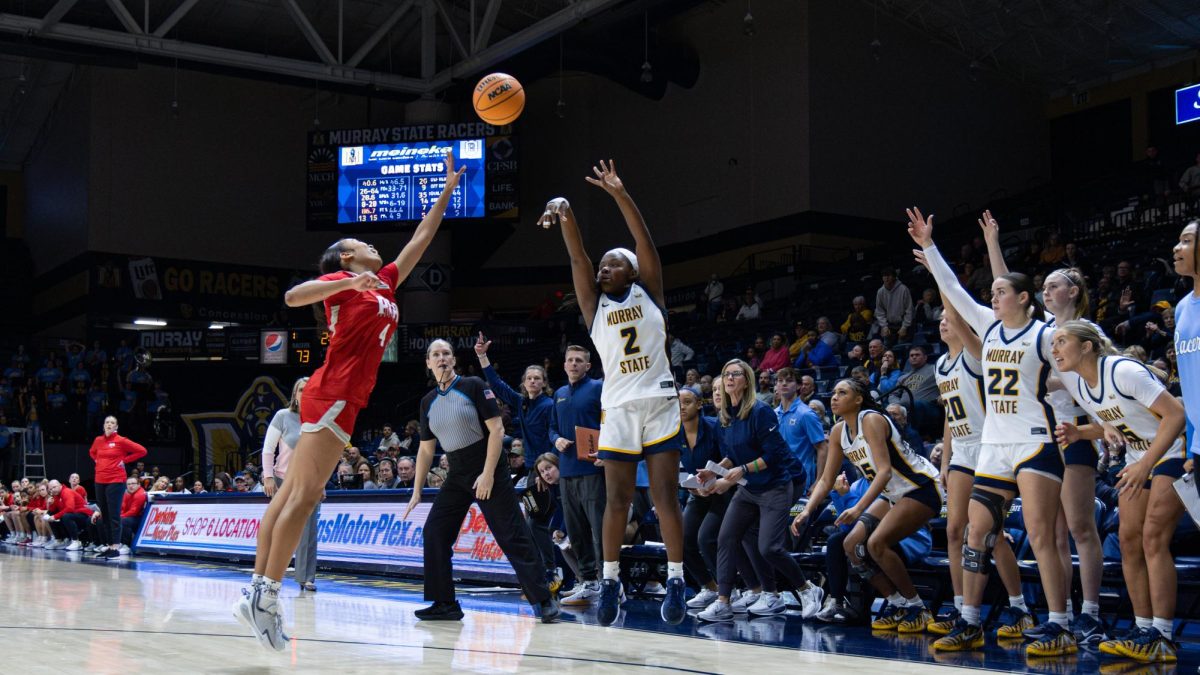 Junior guard shoots a corner three-pointer at the CFSB Center. 