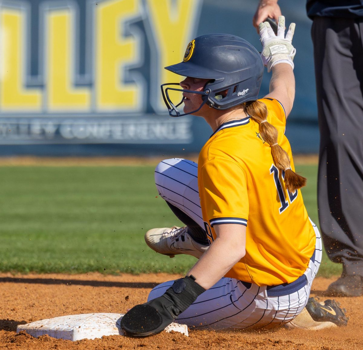 Junior outfielder Courtney Sandy slides into second base after driving in a run.