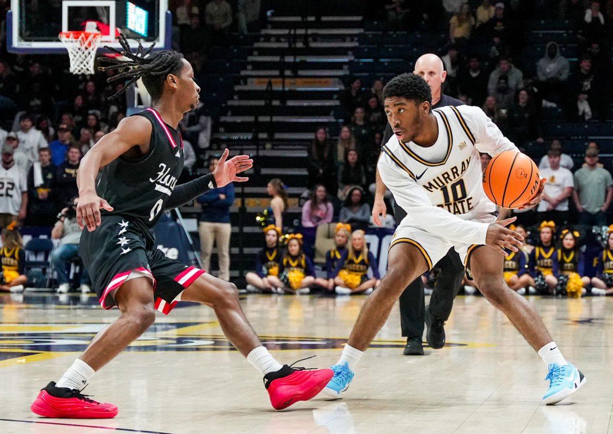 Sophomore Guard KJ Tenner looking to make a play against an UIC player. 