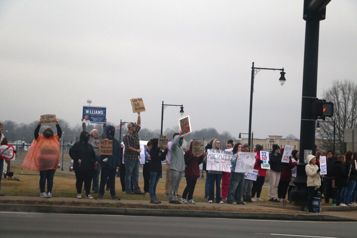 The crowd formed on the street corner of 121 North and 12 Street in Murray, protesting ICE.