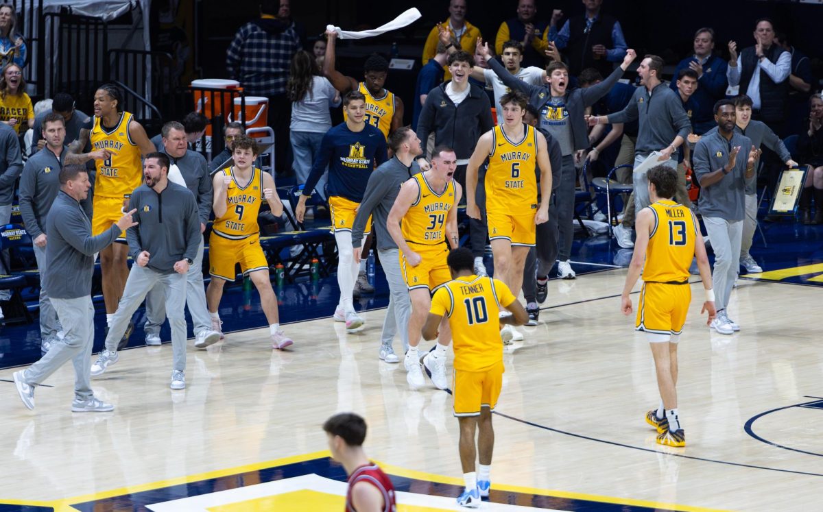 The Racers celebrate as they walk onto the court after Belmont calls a timeout. 