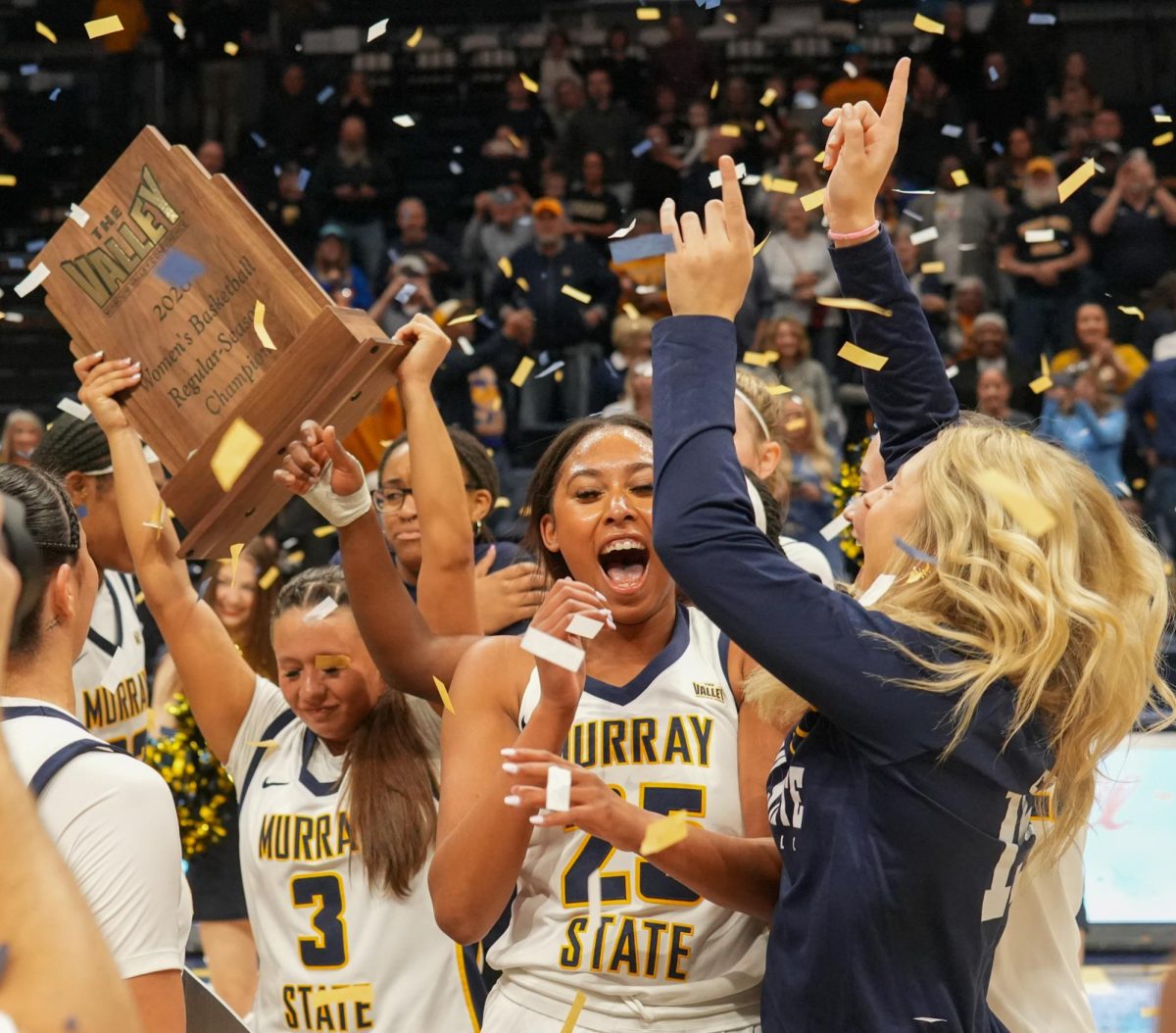 The Racers celebrate with the MVC regular season champion trophy. 