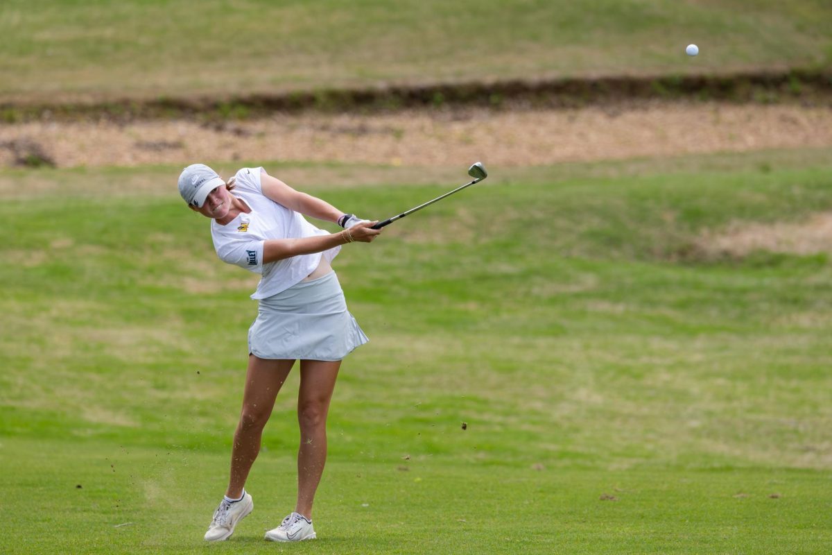 Junior Katherine Weir hits her second shot on the playoff hole. 
