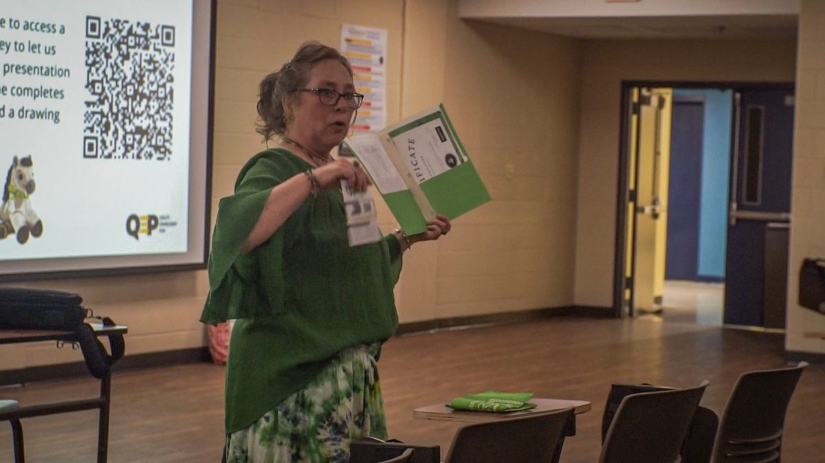 Letitia Usher explains the certification package new members receive.